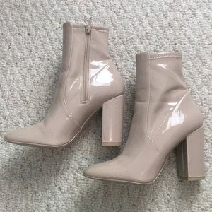 Nude heeled booties.